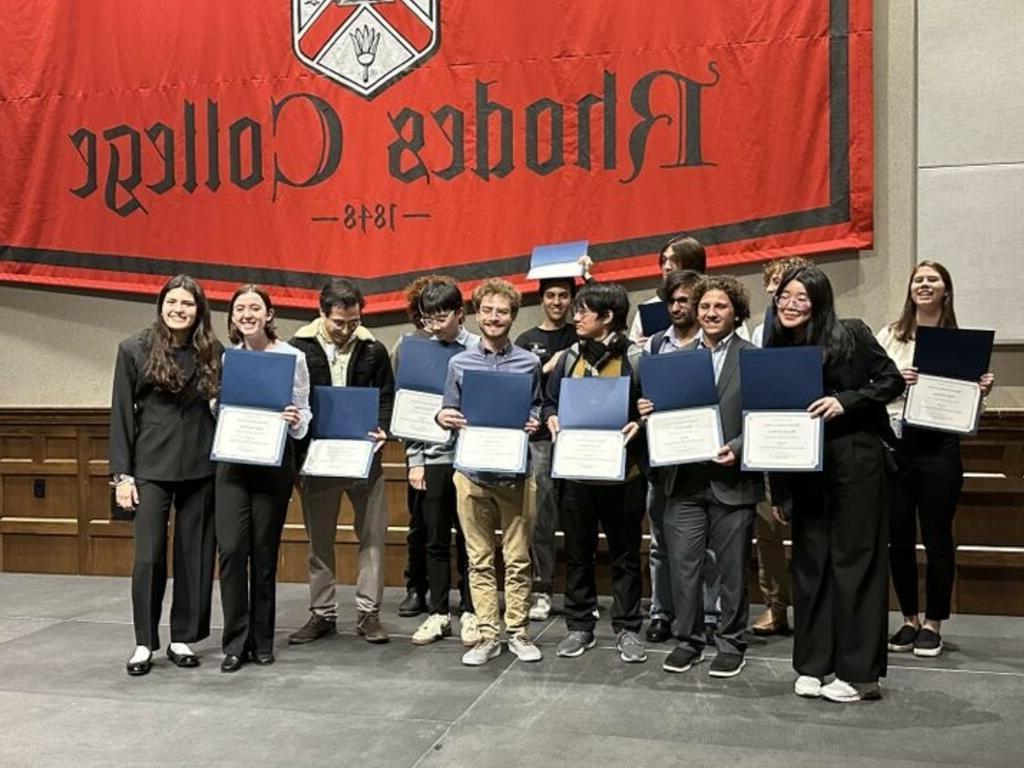 image of Rhodes College group holding certificates
